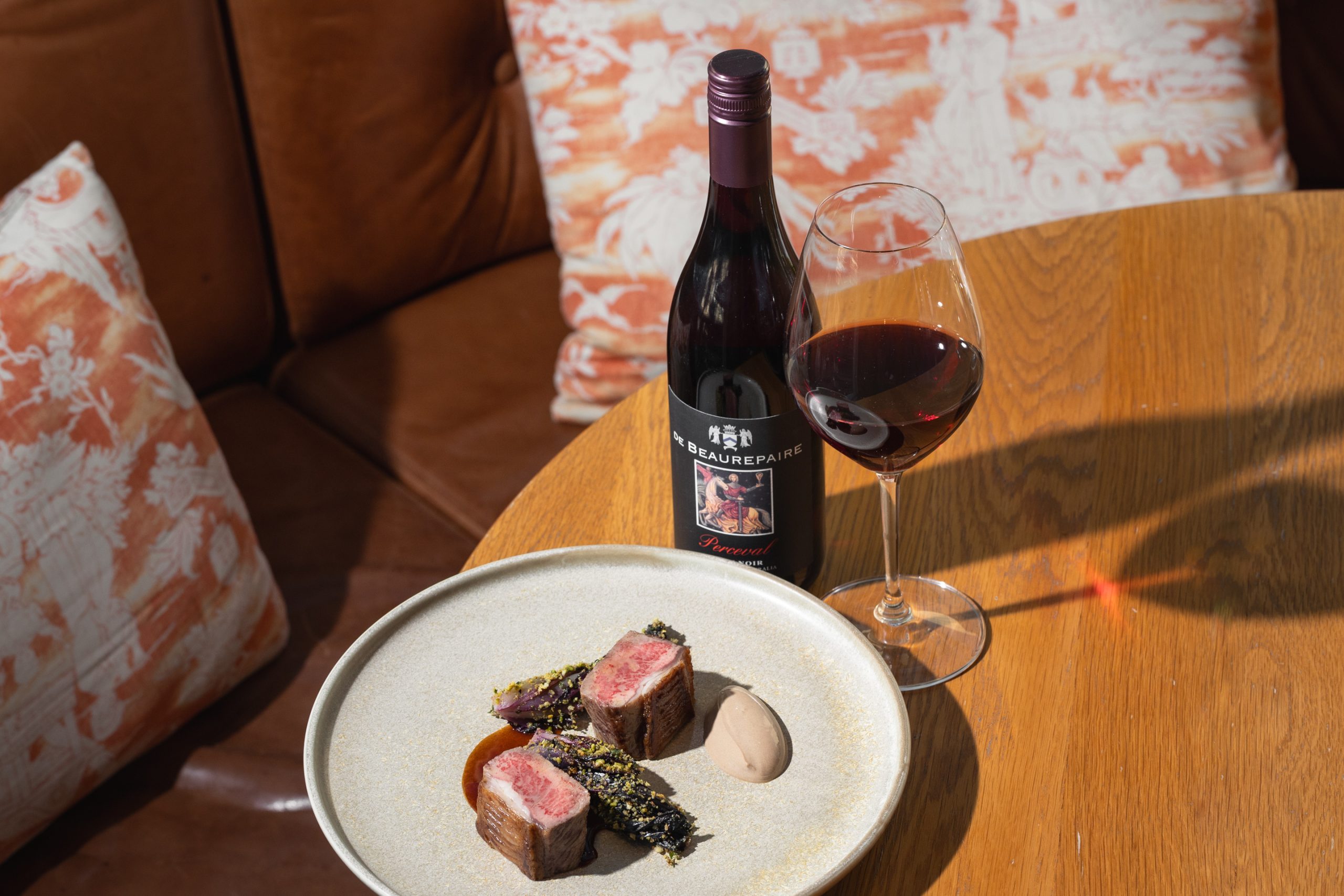 OVEN ROASTED GUNDAGAI LAMB LOIN black garlic yoghurt, wilted treviso, minted lamb jus